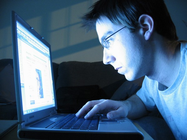 man looking at laptop
