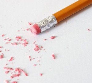 Yellow pencil with eraser shavings to illustrate editing
