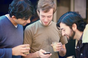 Friends looking at cell phone