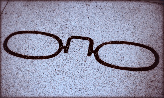 Eyeglasses in terrazzo sidewalk