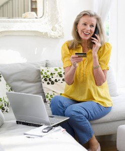 Mature Woman Shopping Online --- Image by © moodboard/Corbis