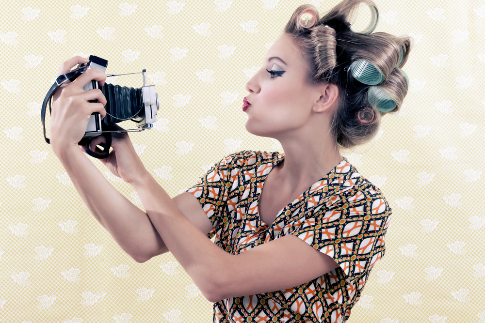 women with vintage camera
