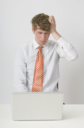Frustrated Man Working On Laptop