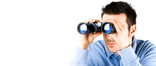 Man-looking-through-binoculars
