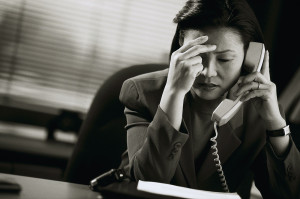 Frustrated Businesswoman on Telephone