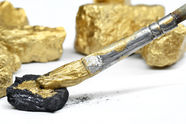 a paintbrush turns coal gold