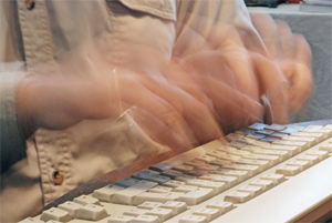 Fast typing fingers on keyboard