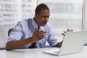 man angry at computer