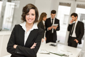 Business leader looking at camera in working environment