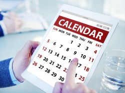 Hands Holding Digital Tablet Calendar
