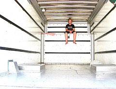 person inside empty moving truck