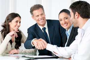 team-smiling-with-handshake