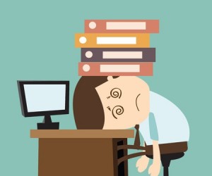 Businessman suffering his point of pain under files and books.