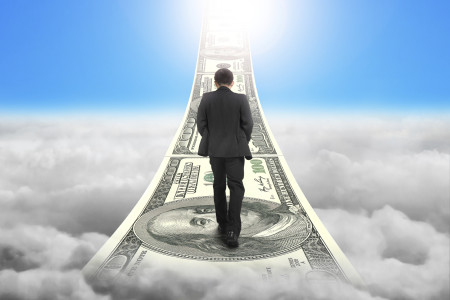 Businessman walking on the money stairs with sky sunlight cloudscape