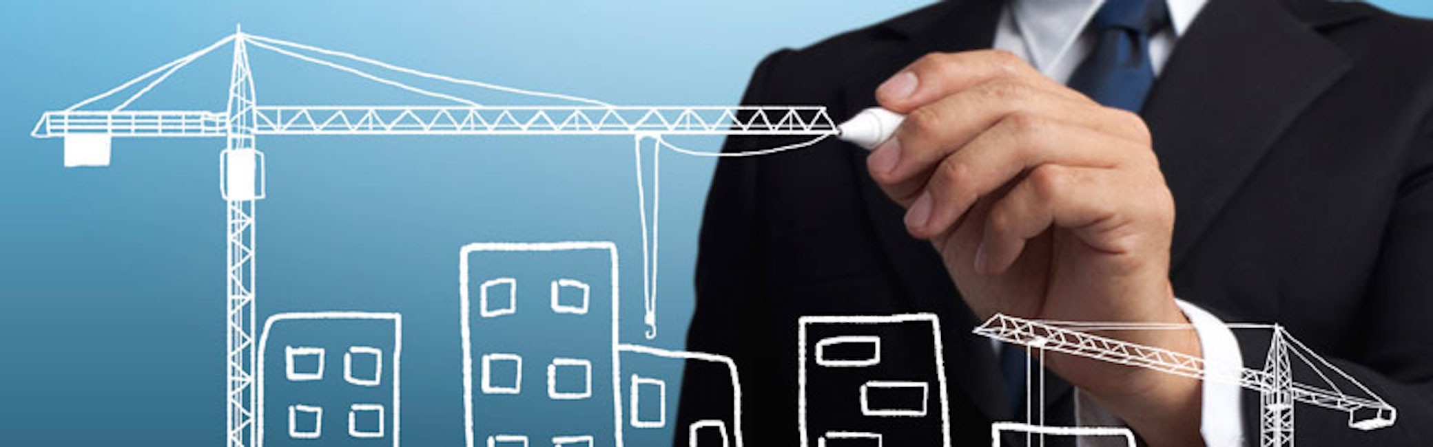 business man drawing construction site
