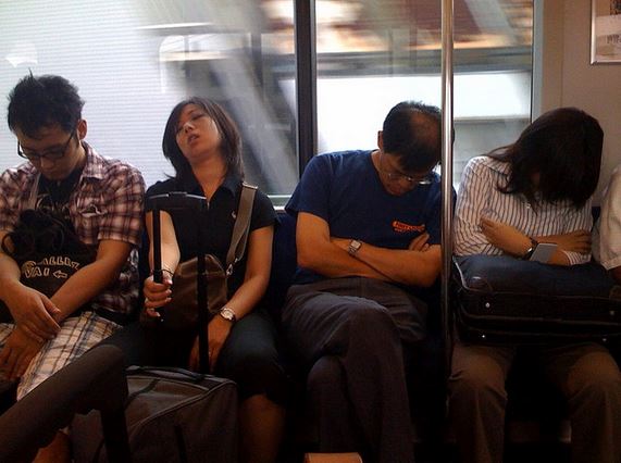 earning links is hard work and this photo shows four exhausted people on a busy subway line