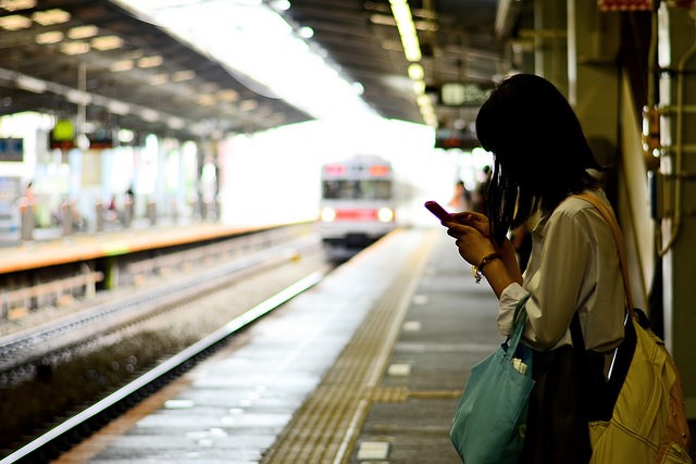 social media customer service image of a woman on her phone