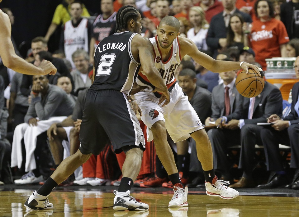 Trail Blazers forward Nic Batum defended by Spurs forward Kawhi Leonard.