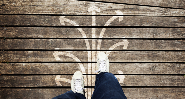 White shoes on a wooden floor with white arrows.