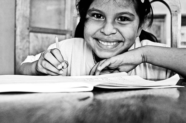 black and white close-up photo of a young girl