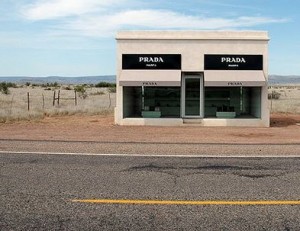 Image of a Prada window display in the desert is a good analogy for how to explain seo benefits in layman