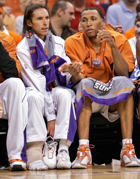 Phoenix Suns guard Steve Nash (left) and teammate Shawn Marion sit on the bench during a game in 2006.
