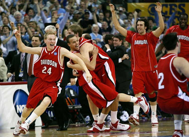 Stephen Curry celebrates with Davidson teammates after beating Georgetown.