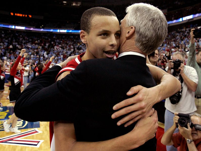 Stephen Curry hugs head coach Bob McKillop following Davidson