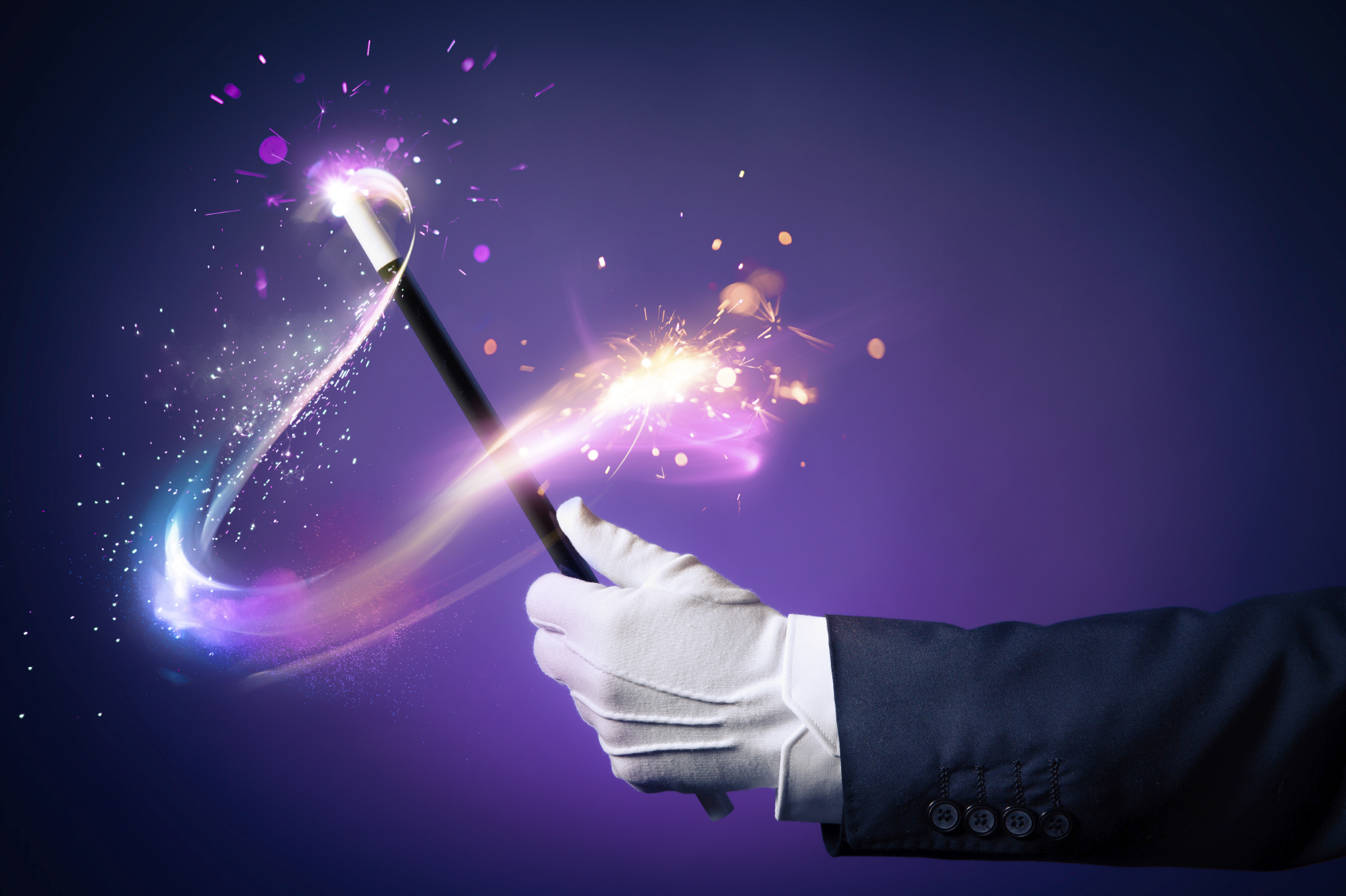 Magician hand with magic wand