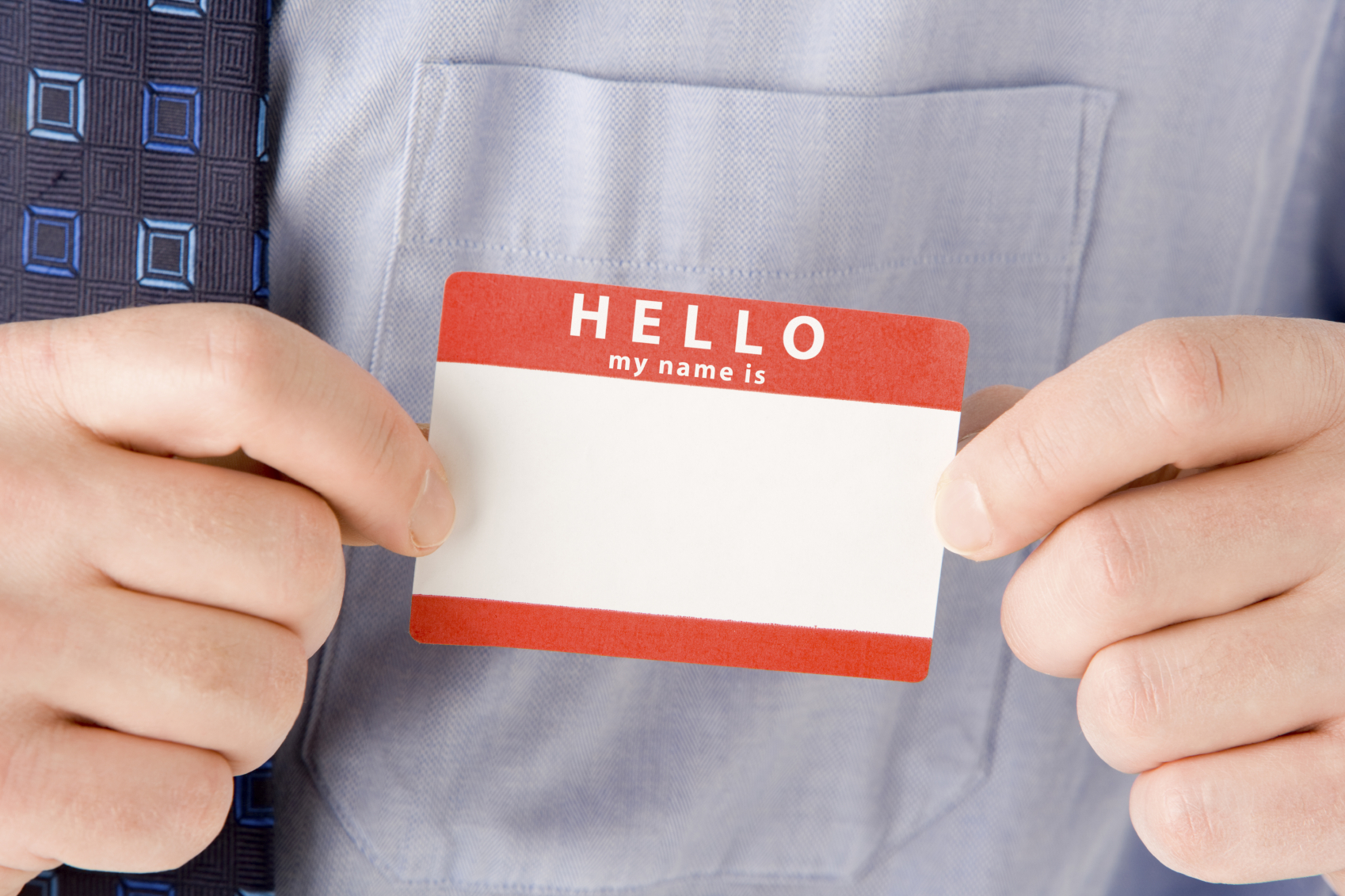 Close Up Of Businessman Attaching Name Tag