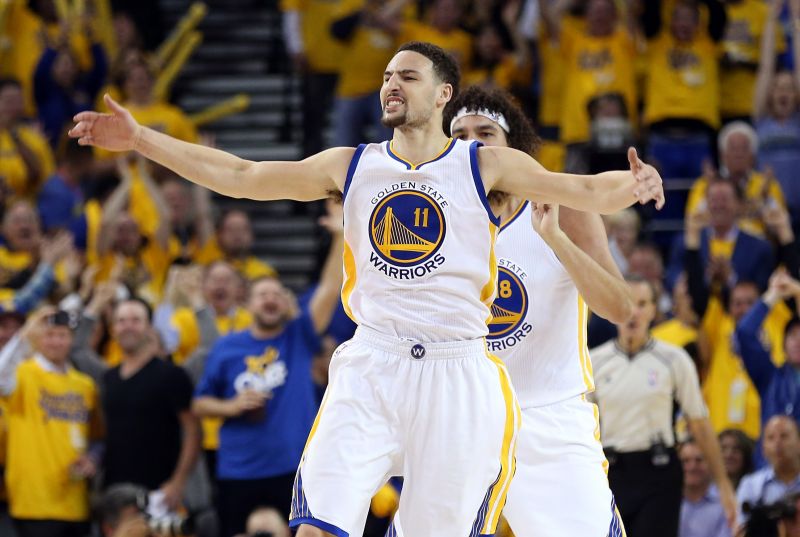 Golden State Warriors guard Klay Thompson celebrates after making a three-point basket in the 2016 NBA playoffs.