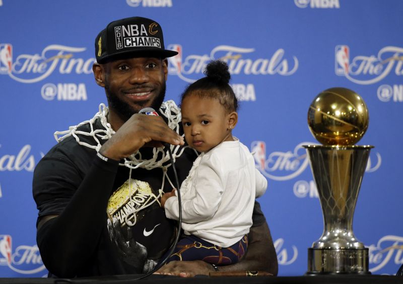 LeBron James of the Cleveland Cavaliers at a press conference with his Finals MVP trophy.