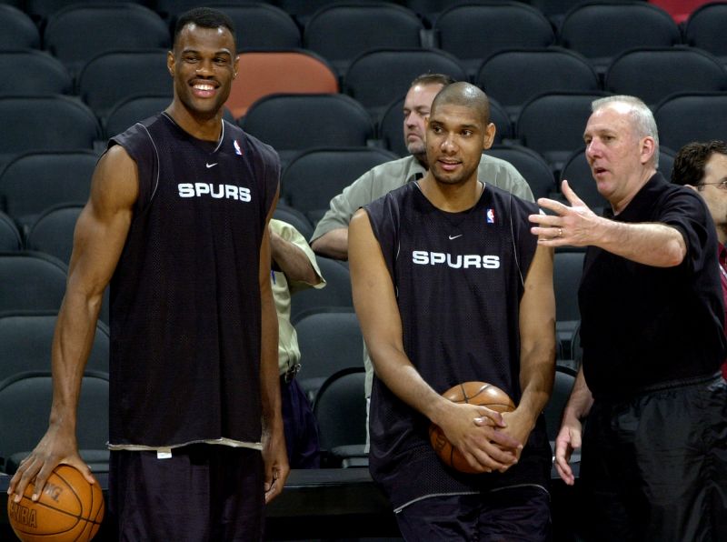 San Antonio Spurs David Robinson (left) and Tim Duncan (middle) stand with head coach Gregg Popovich.