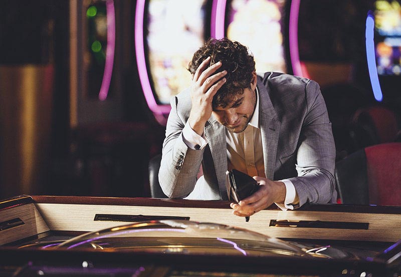 Man loosing at the Casino