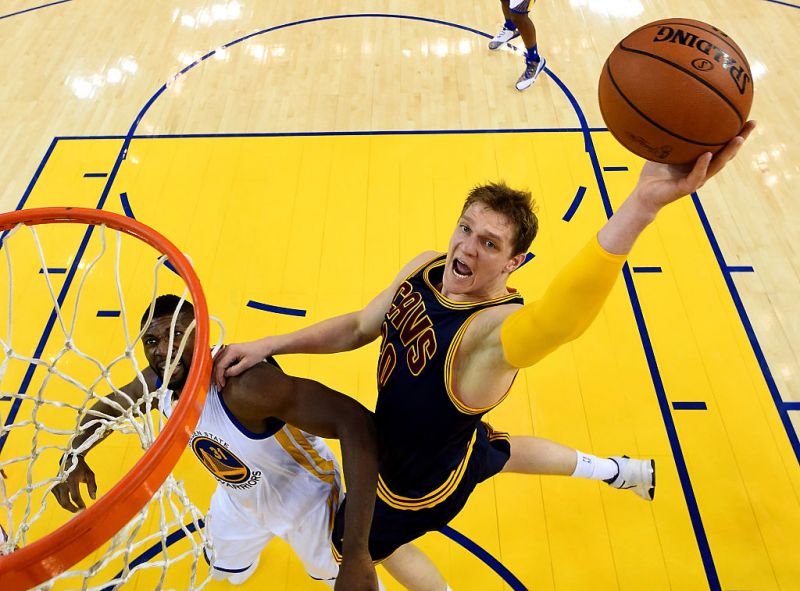 Timofey Mozgov goes up for a shot against Festus Ezeli.