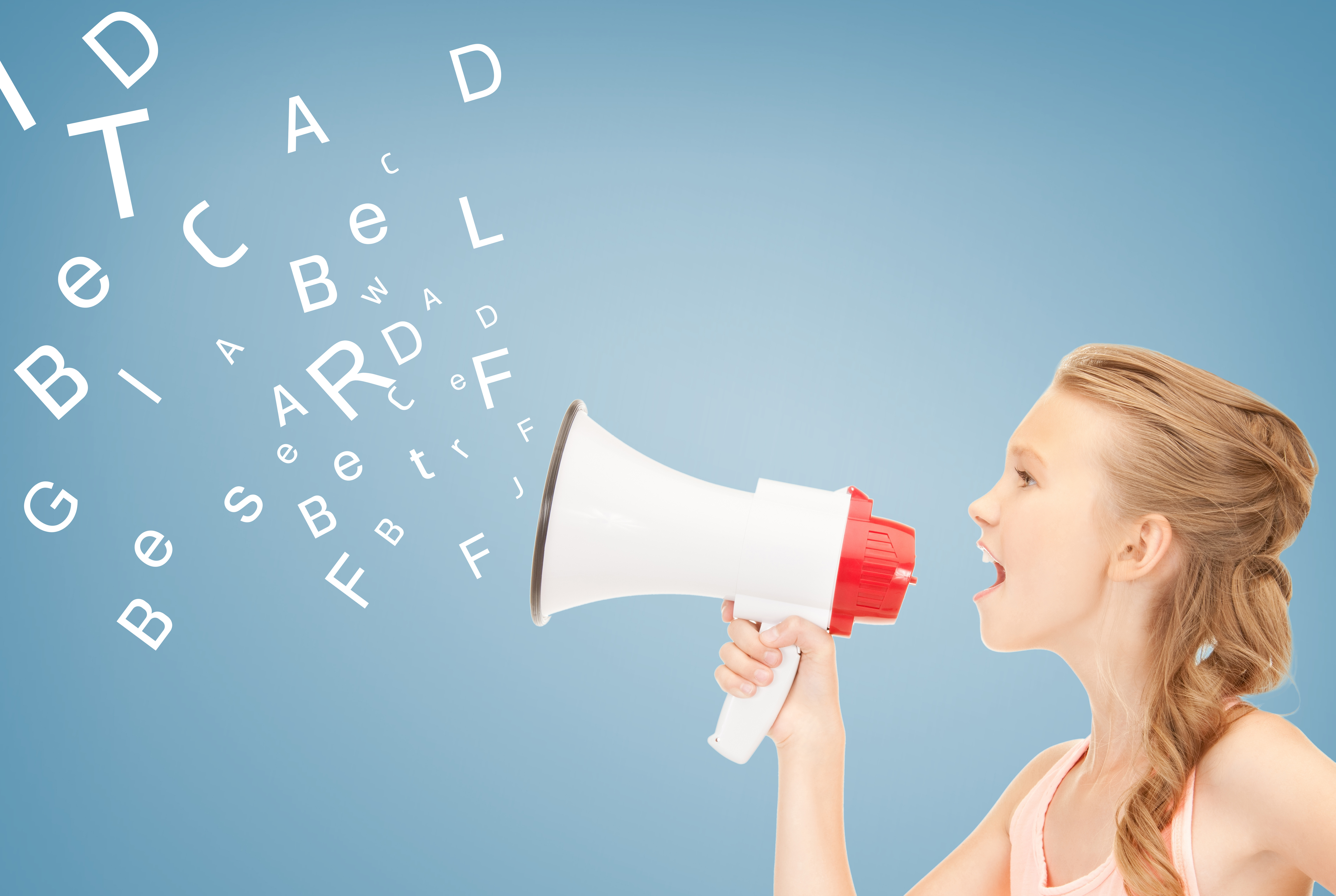 communication concept - girl with megaphone over blue background