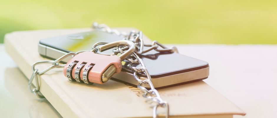 Photo of mobile phone secured by a chain and padlock