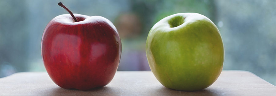 One red apple (referral marketing) compared to one green apple (brand advocacy)