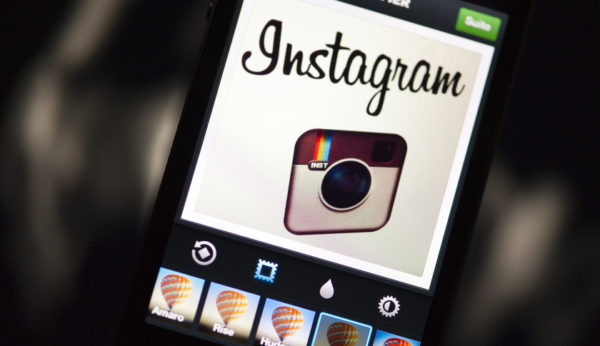 The Instagram logo is displayed on a smartphone on December 20, 2012 in Paris. Instagram backed down on December 18, 2012 from a planned policy change that appeared to clear the way for the mobile photo sharing service to sell pictures without compensation, after users cried foul. Changes to the Instagram privacy policy and terms of service set to take effect January 16 had included wording that appeared to allow people's pictures to be used by advertisers at Instagram or Facebook worldwide, royalty-free. AFP PHOTO / LIONEL BONAVENTURE (Photo credit should read LIONEL BONAVENTURE/AFP/Getty Images)