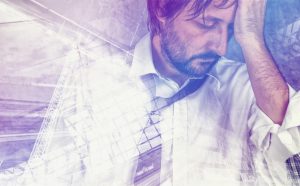 tired-exhausted-businessman-in-trouble-double-exposure-300x186