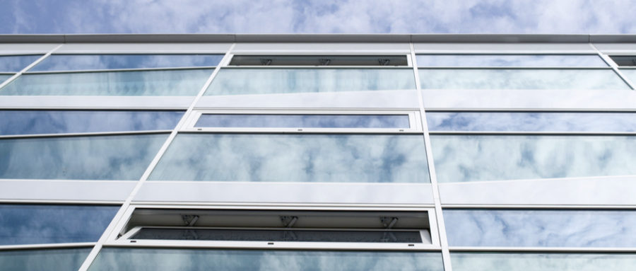 cloud reflection on warehouse windowx