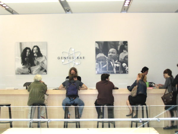 Customers wait to be served at the Apple Genius Bar