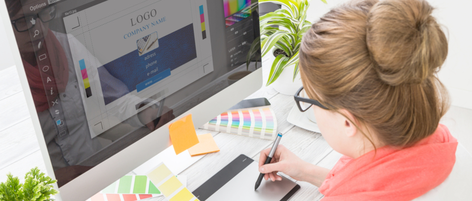 a designer creating a logo on computer