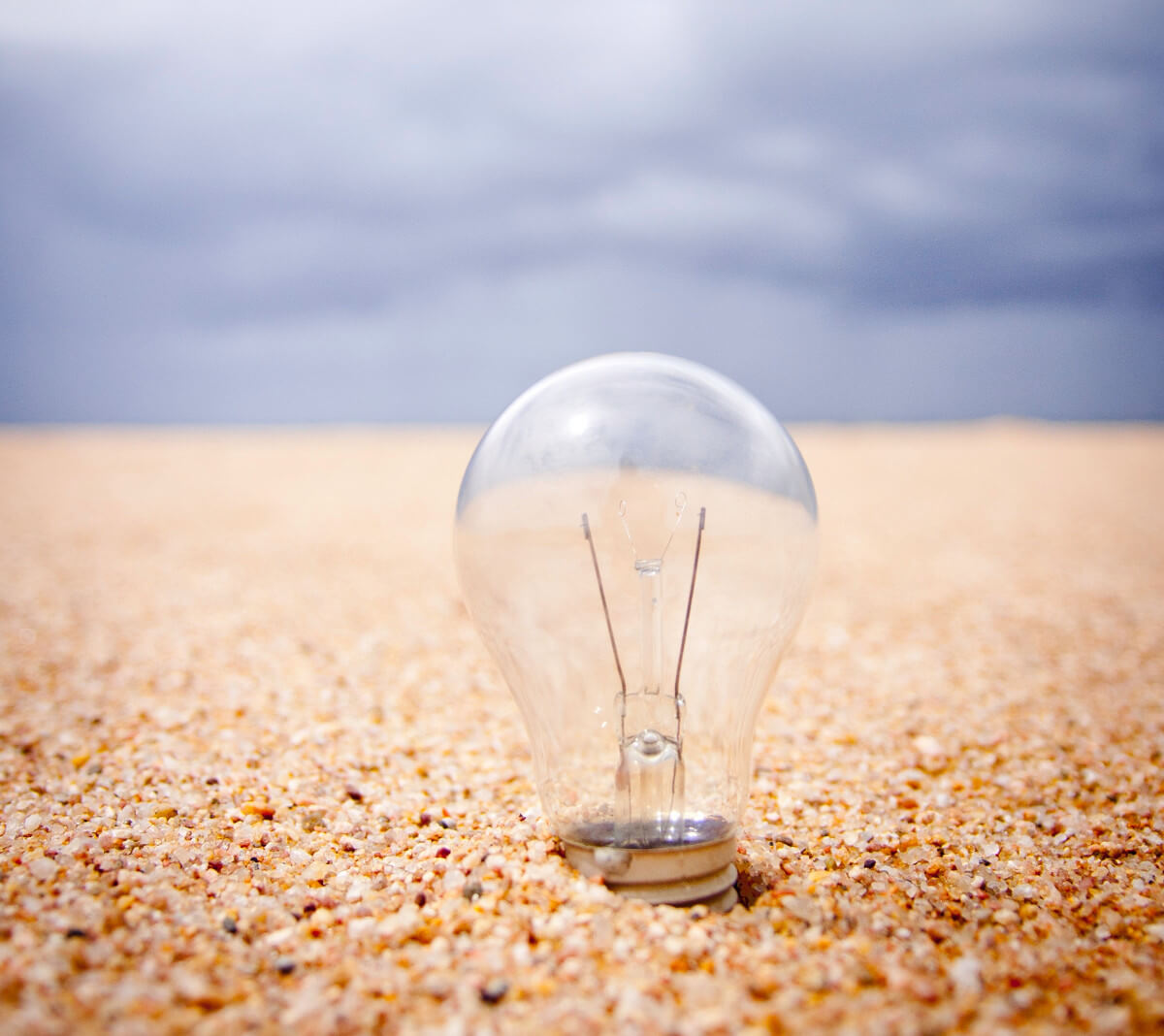 A lightbulb in sand