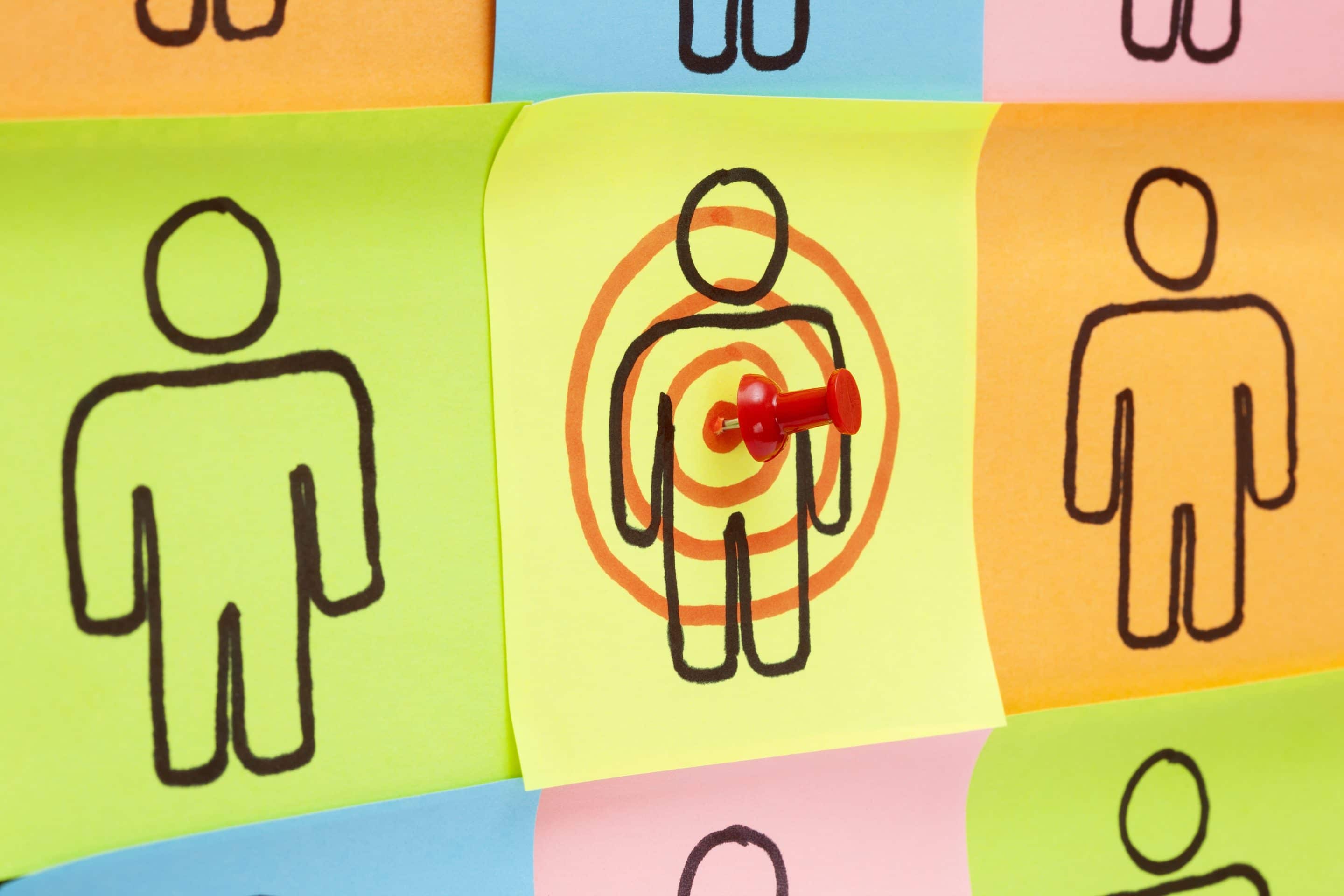 Target your customers concept made with sticky notes on cork board