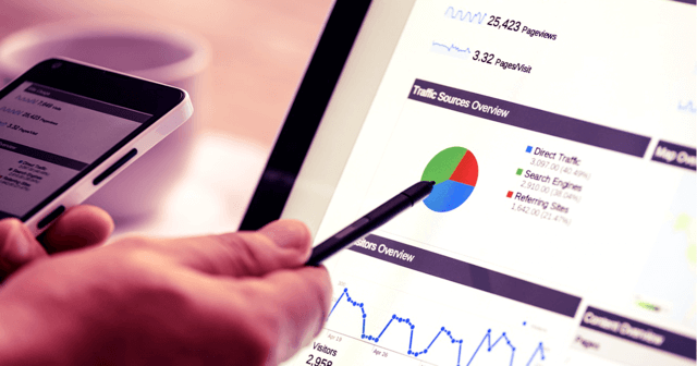 A hand with a pen pointing to a graph on a computer. SEO best practices arent often as cut and dry as a graph and a list of data. Learn more.