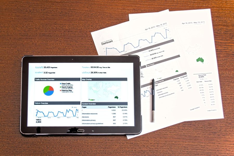Data on a tablet and sheets of paper