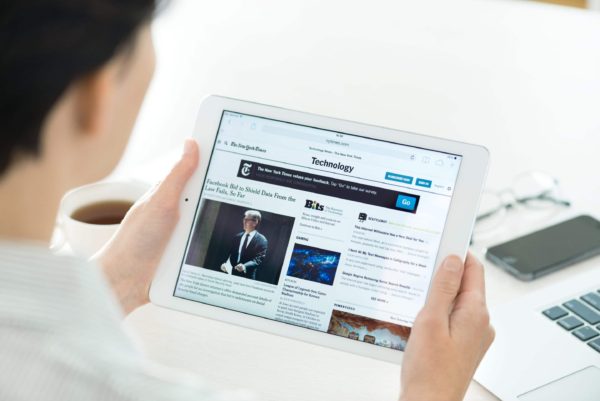 Woman reading news article