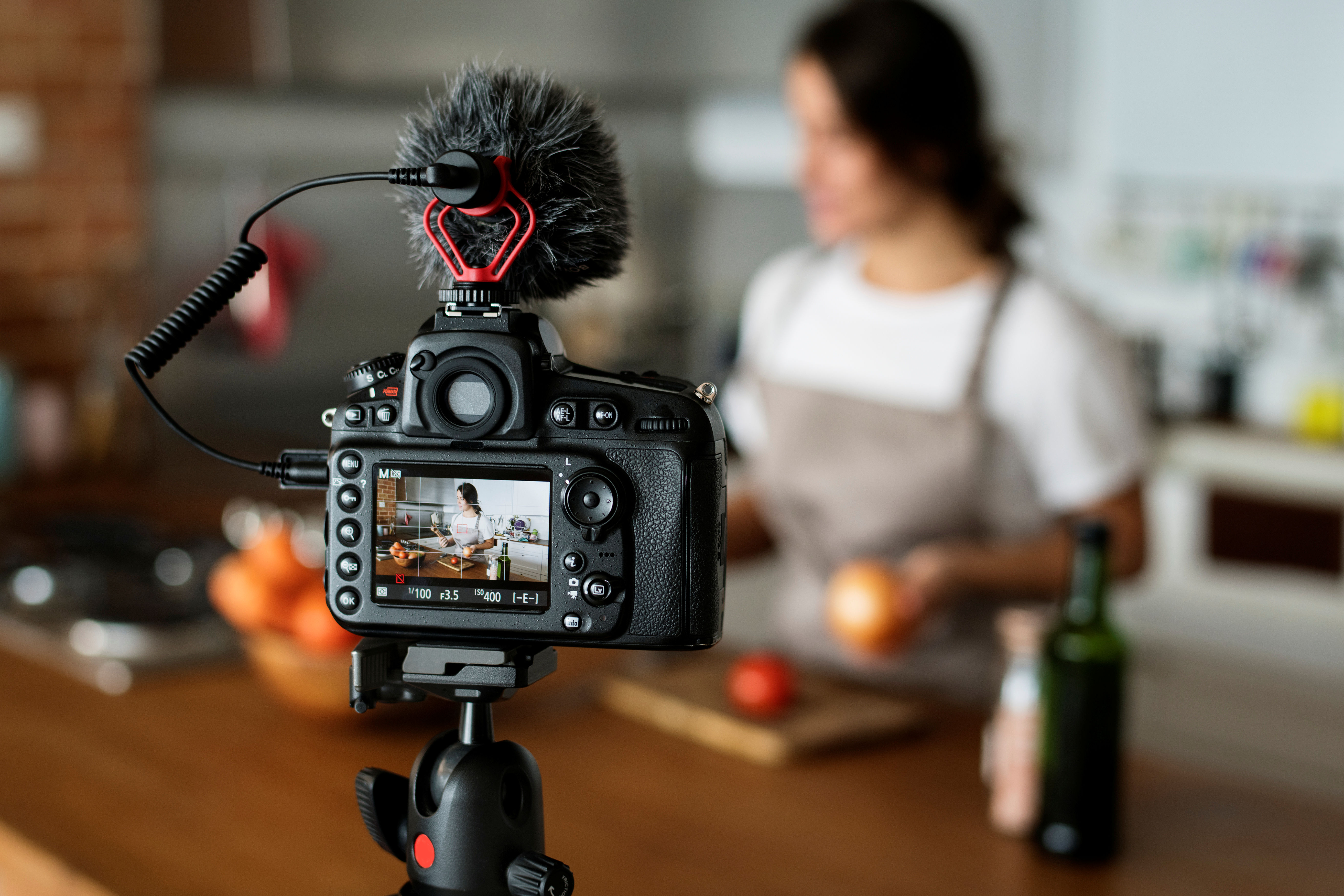 A scene of a woman cooking being filmed. 