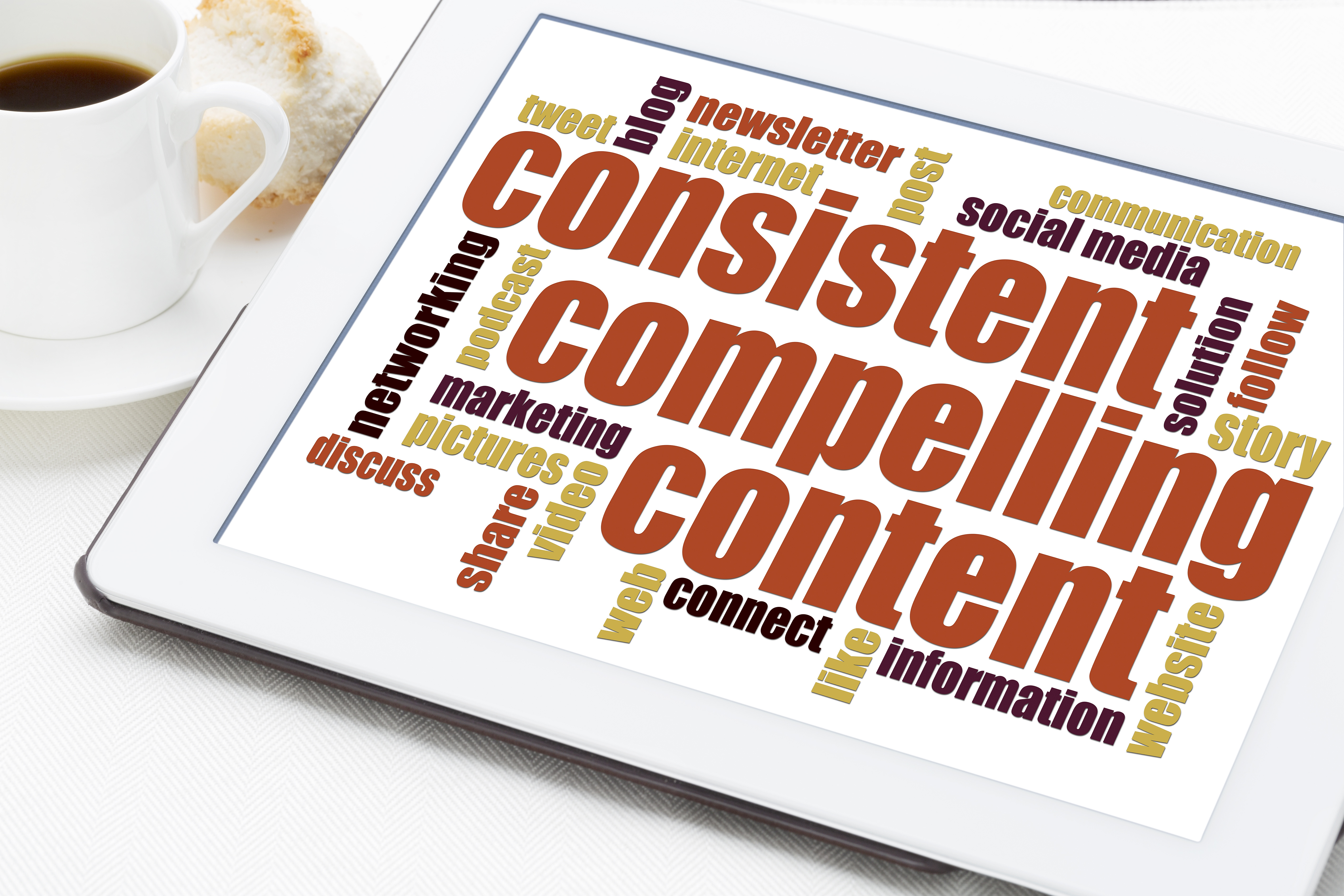 consistent, compelling content - a word cloud on a digital tablet